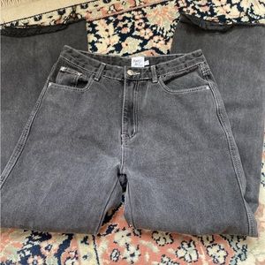 Princess Polly cutoff faded black jeans with contrast stitching.